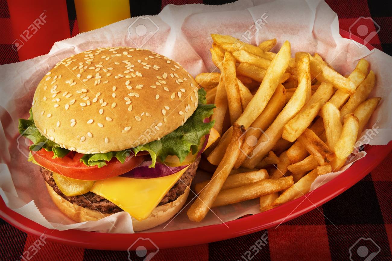 117701764-burger-and-french-fries-in-basket-on-tablecloth-ketchup-and-mustard-bottle-in-background-close-up- The Hopper Brewing & Co. | Poutine | Tasty Meal